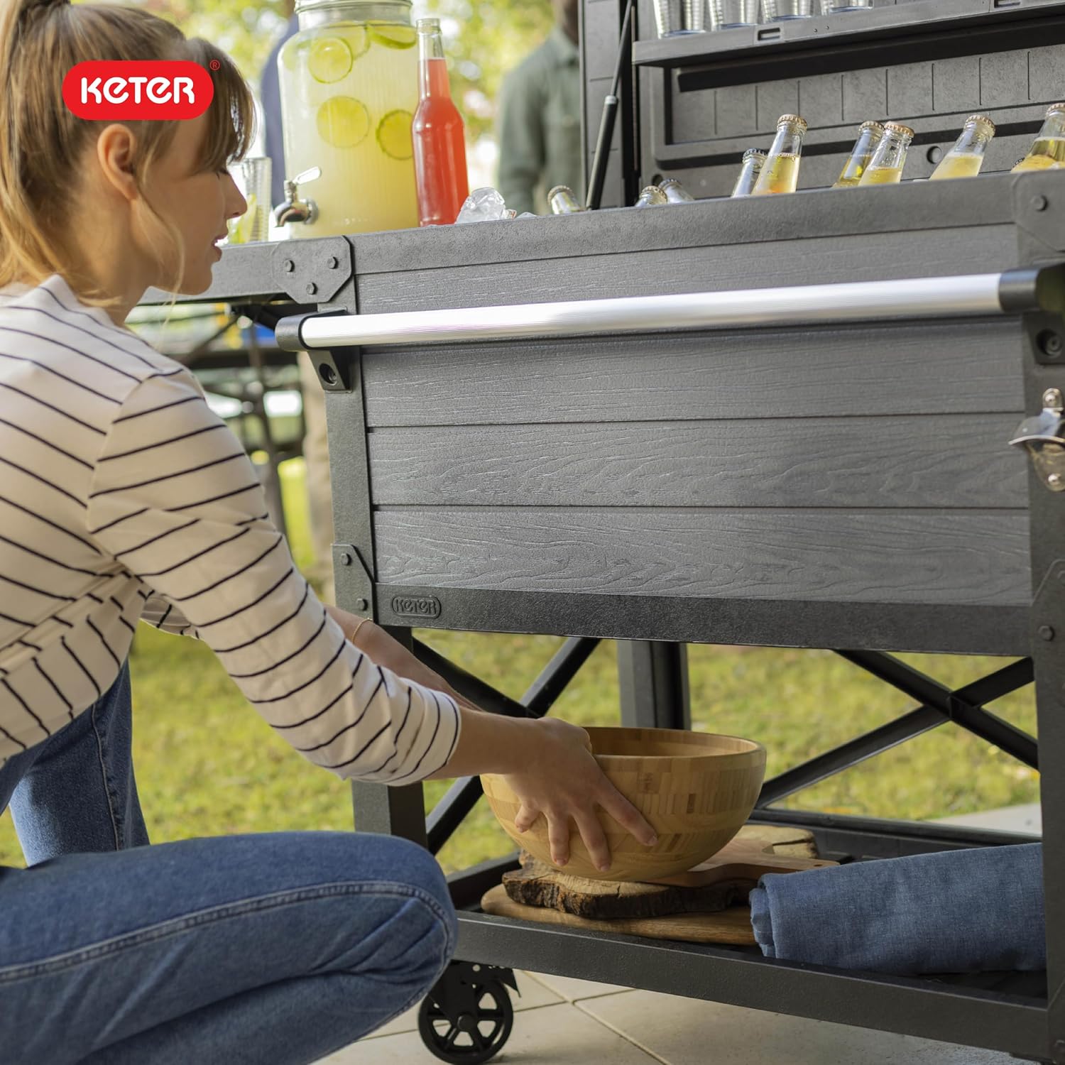 Keter 89.8 Qt Portable Outdoor Patio Cooling Chest, Ice Chest Beverage Party Bar Cart Table with Swivel Wheels, Shelves, and Bottle Opener, Graphite