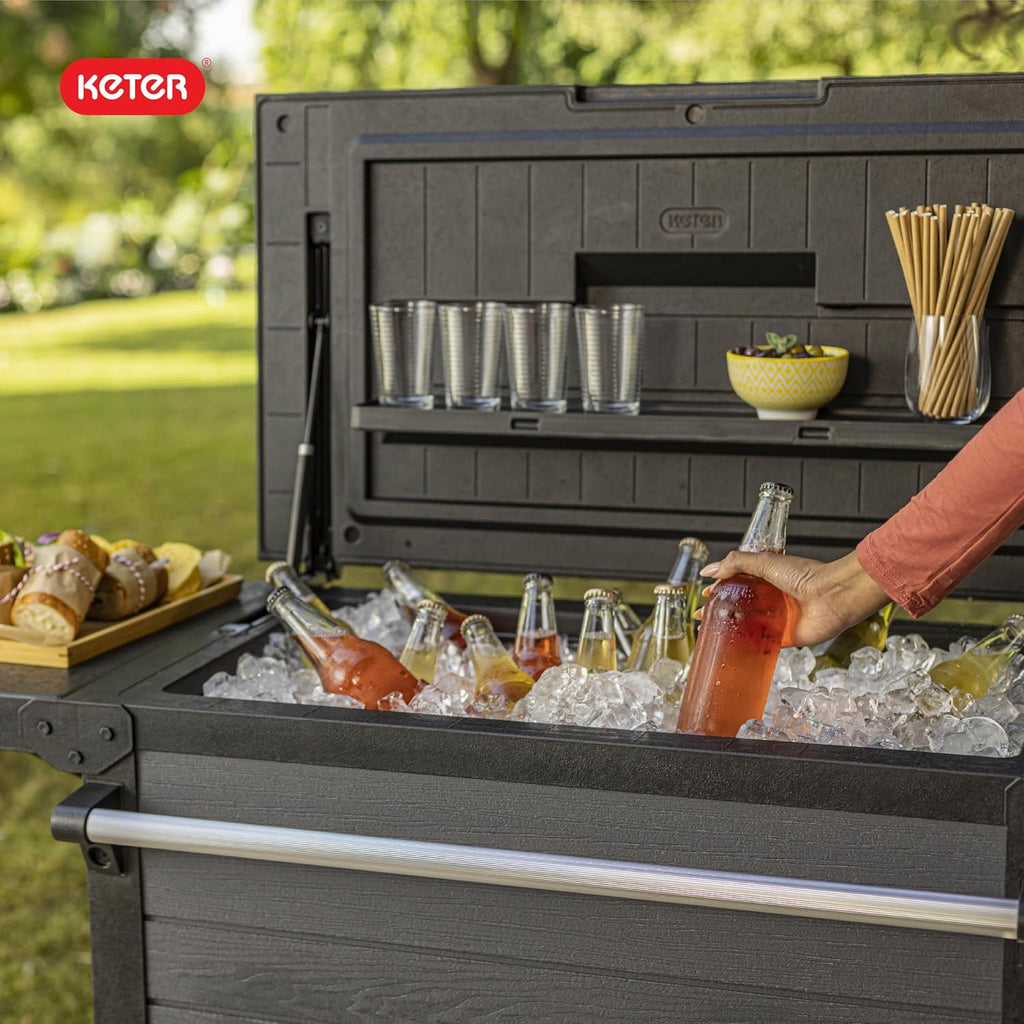 Keter 89.8 Qt Portable Outdoor Patio Cooling Chest, Ice Chest Beverage Party Bar Cart Table with Swivel Wheels, Shelves, and Bottle Opener, Graphite