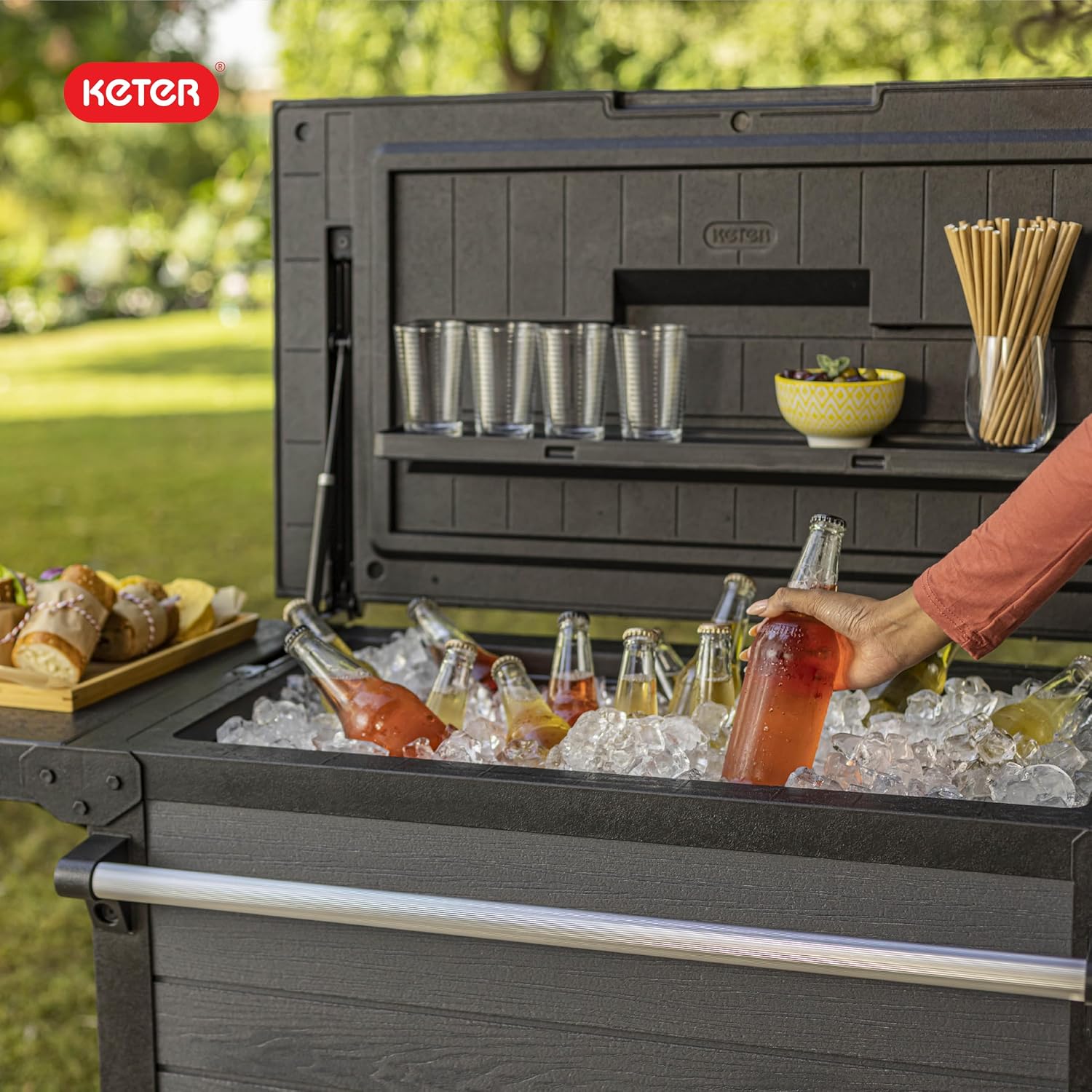 Keter 89.8 Qt Portable Outdoor Patio Cooling Chest, Ice Chest Beverage Party Bar Cart Table with Swivel Wheels, Shelves, and Bottle Opener, Graphite