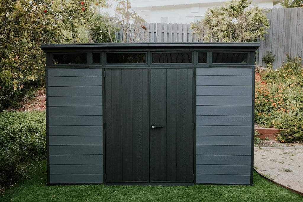 Keter Cortina 11x7 Ft All-Weather Storage Shed with Skylight, Window, Built-in Ventilation, Customizable Walls, & Lockable Double Doors, Graphite