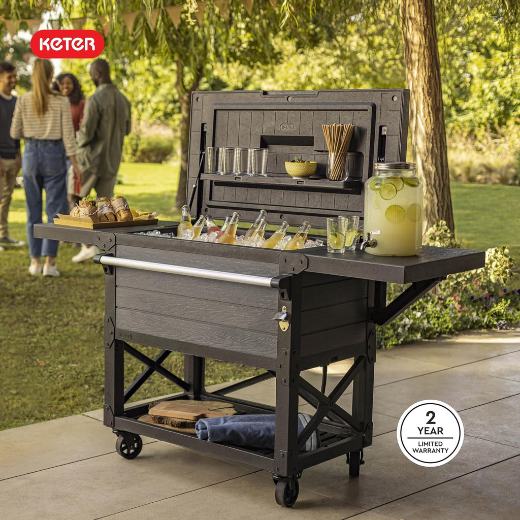 Keter 89.8 Qt Portable Outdoor Patio Cooling Chest, Ice Chest Beverage Party Bar Cart Table with Swivel Wheels, Shelves, and Bottle Opener, Graphite